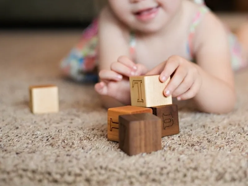 baby play with the wooden toys