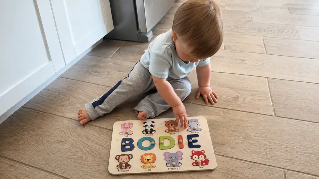 toddler playing with animal puzzle
