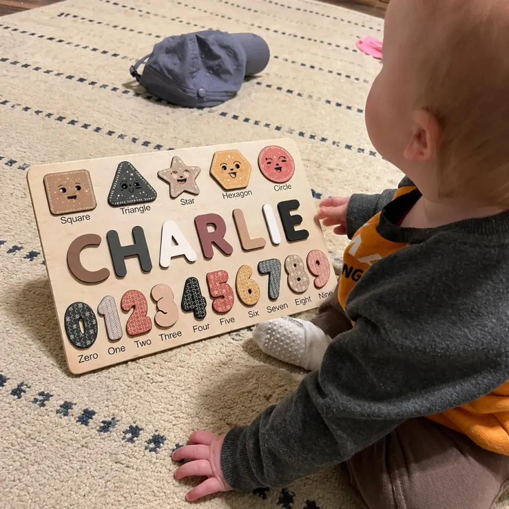toddler playing with shapes & numbers puzzle