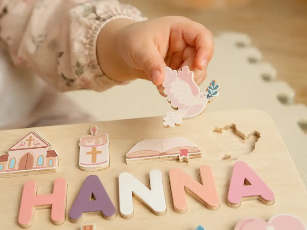 child using name puzzle fine motor