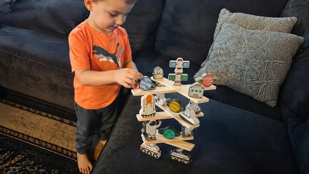 preschooler playing with balance toy